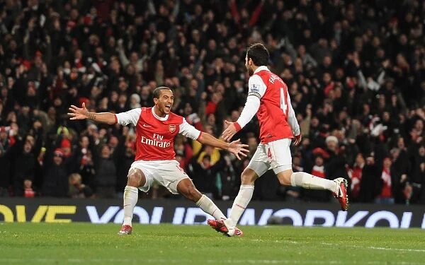 Celebrating Glory: Fabregas and Walcott Rejoice in Arsenal's 3:1 Victory over Chelsea