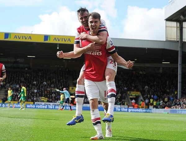 Celebrating Glory: Ramsey and Jenkinson's Unforgettable Goal Connection (Norwich City vs. Arsenal, 2013-14)