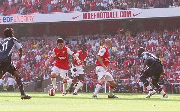 Cesc Fabregas scores Arsenals 2nd goal past Abdoulay Meite (Bolton)