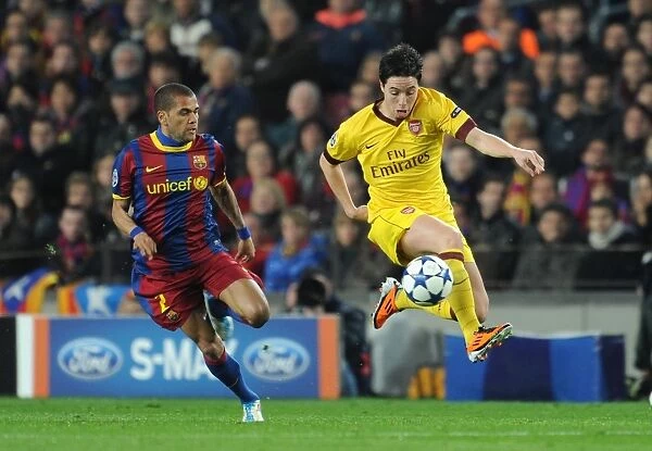 Champions Clash: Nasri vs. Alves in Barcelona's 3:1 UEFA Champions League Victory over Arsenal