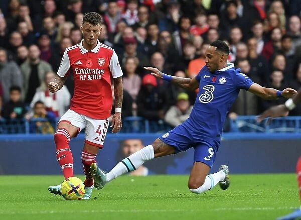 Clash of Blues and Gunners: Aubameyang Fouls White in Intense Chelsea vs. Arsenal Premier League Showdown (2022-23)