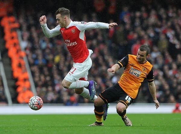 Clash at The Emirates: A Battle between Calum Chambers and Shaun Maloney in the FA Cup Fifth Round