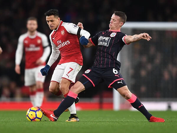 Clash at Emirates: Sanchez vs. Hogg in Arsenal's Battle Against Huddersfield