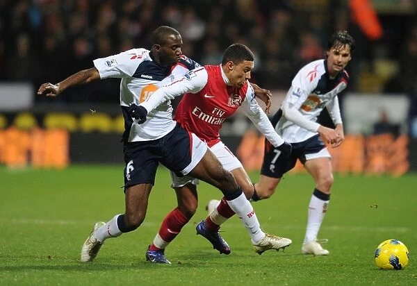 Clash of Forces: Oxlade-Chamberlain vs. Muamba in Premier League Battle