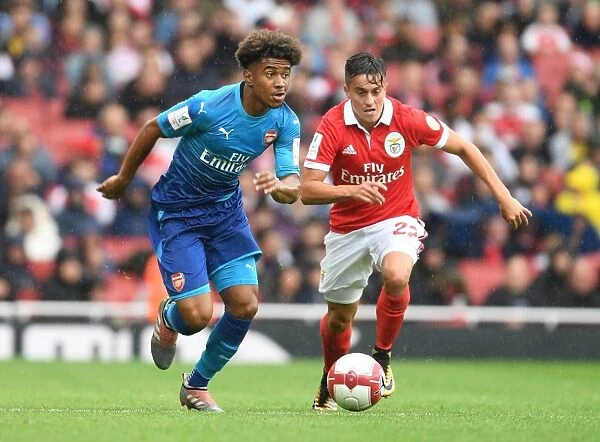 Clash of Skills: Reiss Nelson vs. Franco Cervi at the Emirates Cup