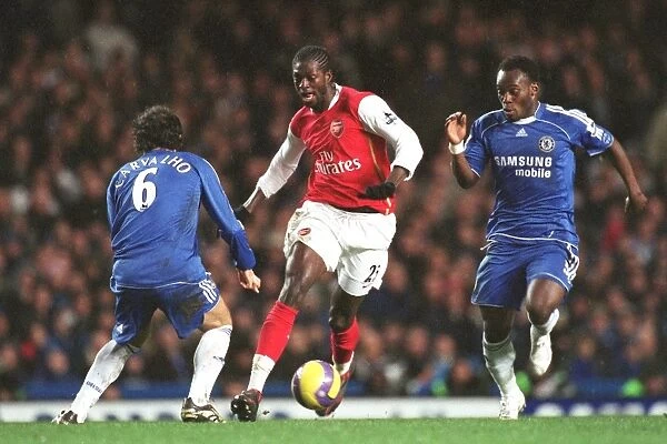 Clash of Titans: Adebayor, Carvalho, and Essien Face Off in the 1:1 Battle at Stamford Bridge, FA Premiership, 10 / 12 / 06