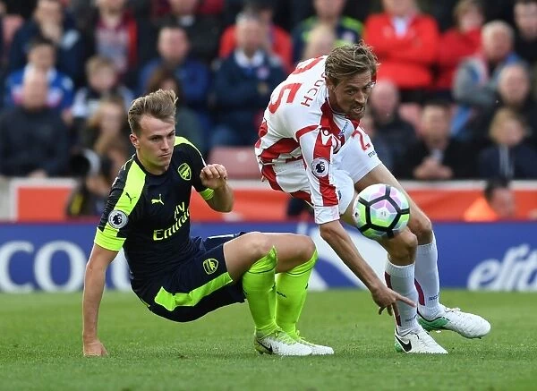 Clash of Titans: Holding vs Crouch - Arsenal's Battle at Bet365 Stadium