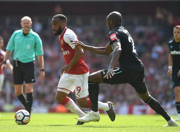 Clash of Titans: Lacazette vs. Ogbonna in Arsenal's Battle Against West Ham