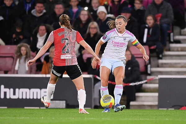 Conti Cup Clash: Arsenal Women vs Southampton Women at St. Mary's Stadium - Katie McCabe Fends Off Pressure