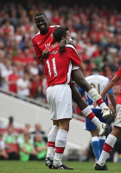 Eboue and van Persie: Unstoppable Duo - Arsenal's 4-0 Thrashing of Wigan Athletic