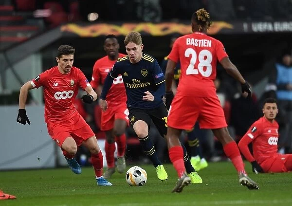 Emile Smith Rowe Clashes with Gojko Cimirot in Standard Liege vs. Arsenal UEFA Europa League Match