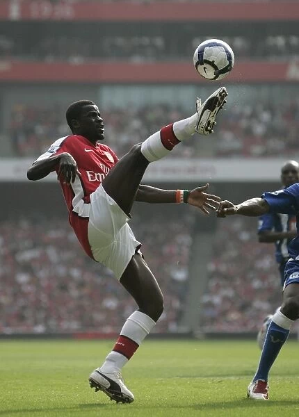 Emmanuel Eboue's Stellar Performance: Arsenal Crushes Wigan Athletic 4-0 in the Premier League