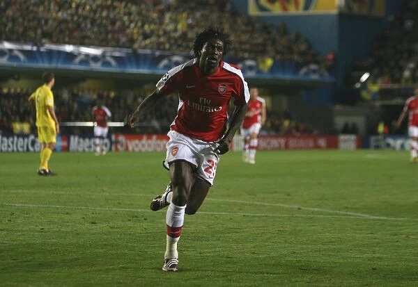 Emmauel Adebayor celebrates scoring the Arsenal goal