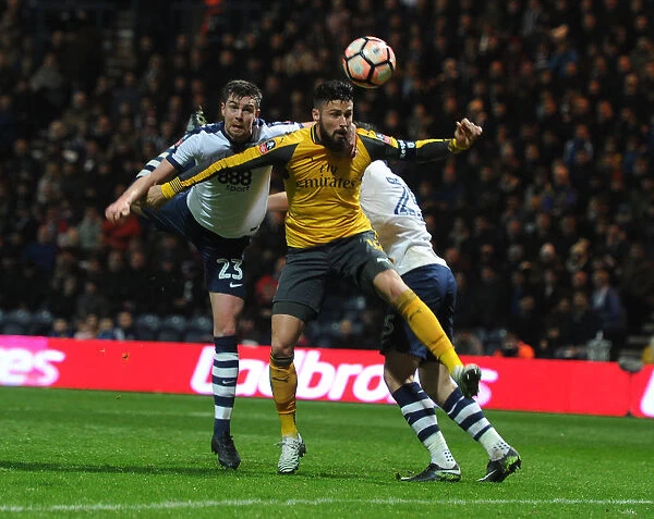 FA Cup Battle: Giroud vs Preston Defenders - A Fight for the Ball