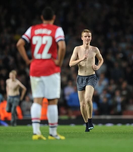 Fan Storms Arsenal Pitch During Capital One Cup Match vs Coventry City