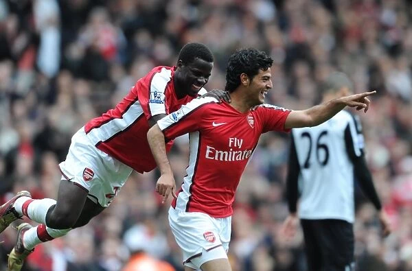 Fourth Goal Celebration: Vela and Eboue, Arsenal's Unstoppable Duo