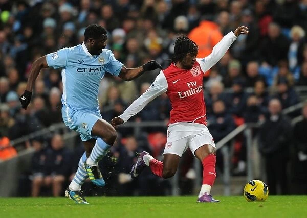 Gervinho Dashes Past Kolo Toure: Manchester City vs. Arsenal, Premier League Showdown (2011-12)