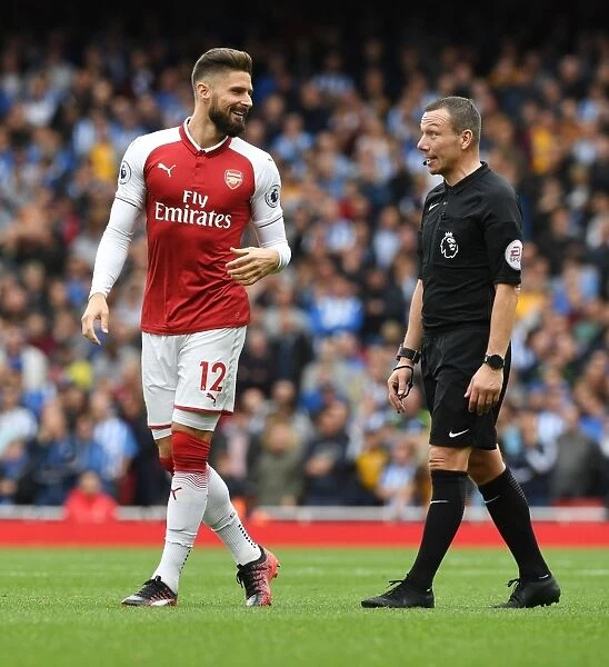 Giroud and Referee Friend: A Moment from the Arsenal vs. Brighton Match, 2017-18 Premier League