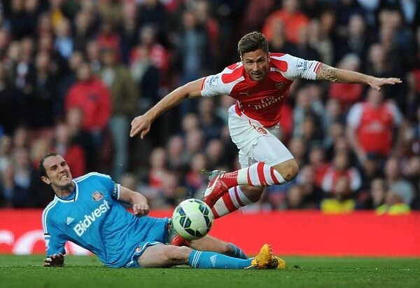 Giroud vs. O'Shea: A Fight for Possession in the Intense Arsenal vs. Sunderland Premier League Clash (2014-15)