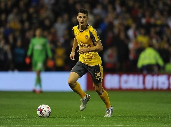 Granit Xhaka in Action: Arsenal's Midfield Maestro Shines Against Nottingham Forest in EFL Cup (2016-17)