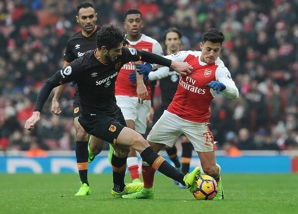 Intense Clash: Sanchez Fouls Ranocchia in Arsenal vs. Hull City Premier League Match