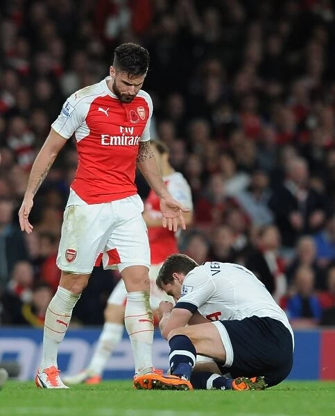 Intense Rivalry: Giroud's Glare-Down on Vertonghen during Arsenal vs. Tottenham Clash