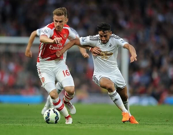 Intense Rivalry: Ramsey vs. Taylor Clash at Arsenal vs. Swansea (2014 / 15)