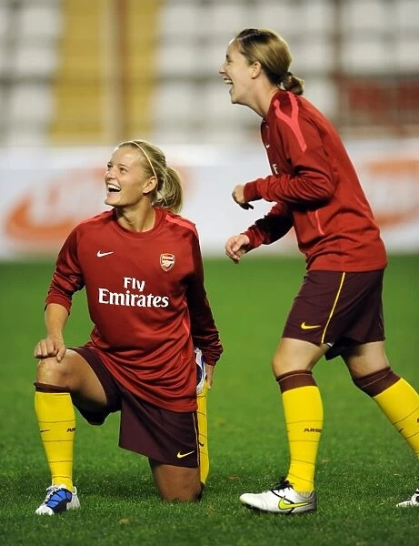 Katie Chapman and Yvonne Tracy (Arsenal) share a joke before the warm up