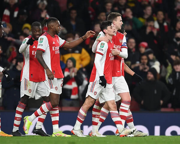 LONDON, ENGLAND - DECEMBER 21: (2ndR) Charlie Patino celebrates scoring the 5th Arsenal goal with (R)