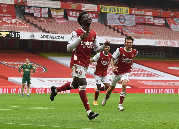 LONDON, ENGLAND - OCTOBER 04: Bukayo Saka celebrates scorign the 1st Arsenal goal during the Premier League match