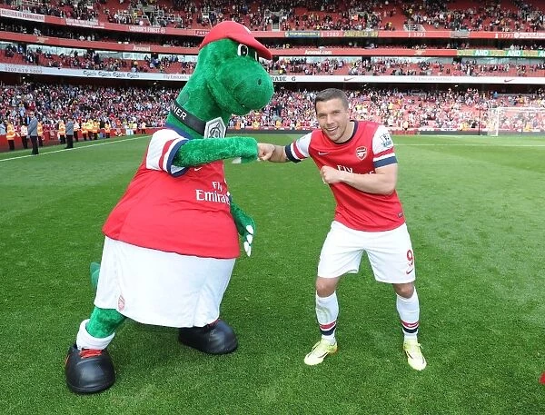 Lukas Podolski with Gunnersaurus: Arsenal vs. West Bromwich Albion, Premier League 2013-14
