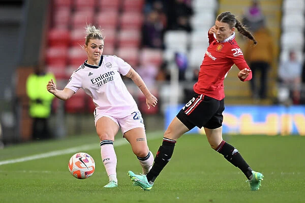Manchester United vs. Arsenal: Women's Super League Clash - Arsenal's Laura Wienroither Fends Off Hannah Blundell