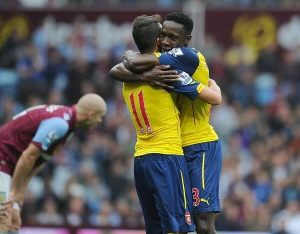 Mesut Ozil and Dany Welbeck Celebrate Arsenal's First Goal vs. Aston Villa (2014-15)