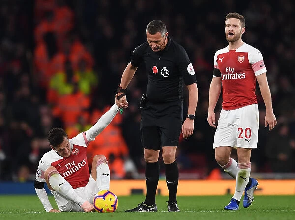 Mesut Ozil in Distress: Referee Andre Marriner Steps In During Arsenal vs. Liverpool Clash (2018-19)