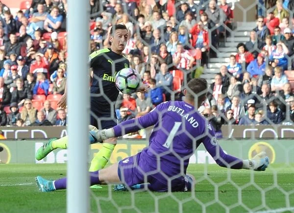 Mesut Ozil Scores Stunning Chip Over Jack Butland in Arsenal's Victory Against Stoke City