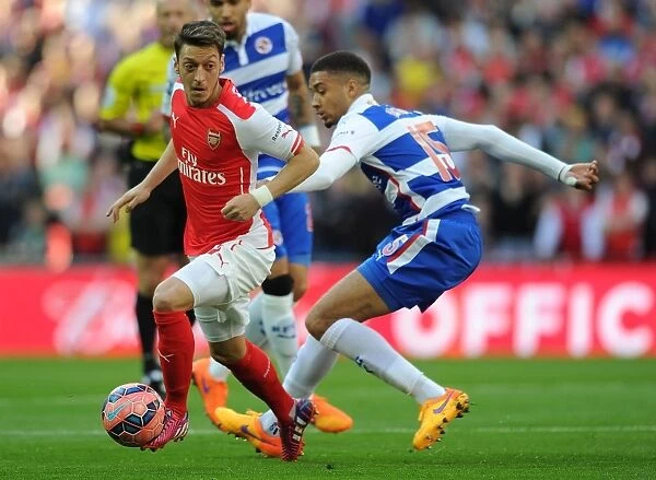 Mesut Ozil Stands Firm Against Michael Hector in FA Cup Semi-Final Clash