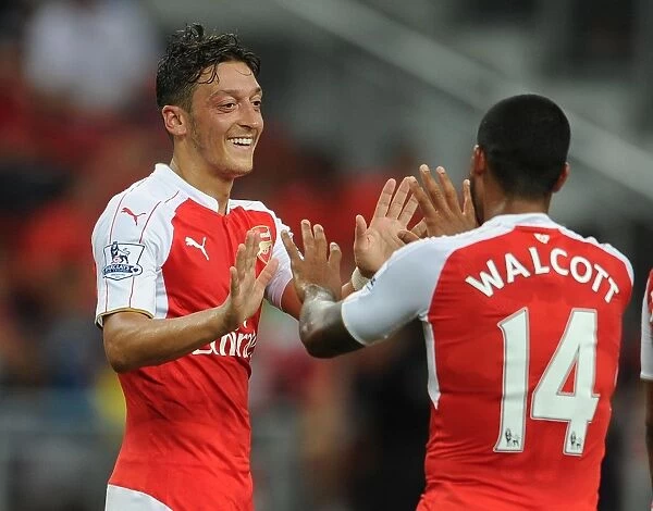 Mesut Ozil and Theo Walcott: Celebrating a Goal for Arsenal against Everton in the 2015 Asia Trophy