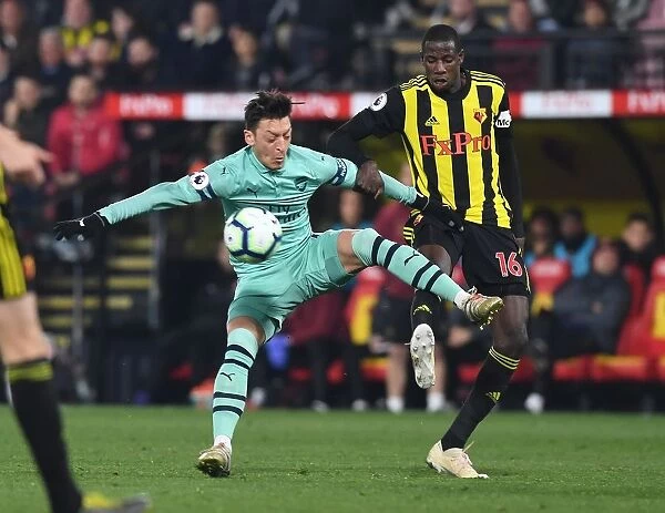 Mesut Ozil vs Abdoulaye Doucoure: A Premier League Battle of Skills and Strength