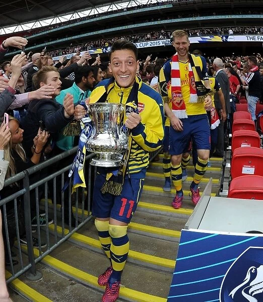Mesut Ozil's FA Cup Triumph: Arsenal's Victory Celebration at Wembley (2015)