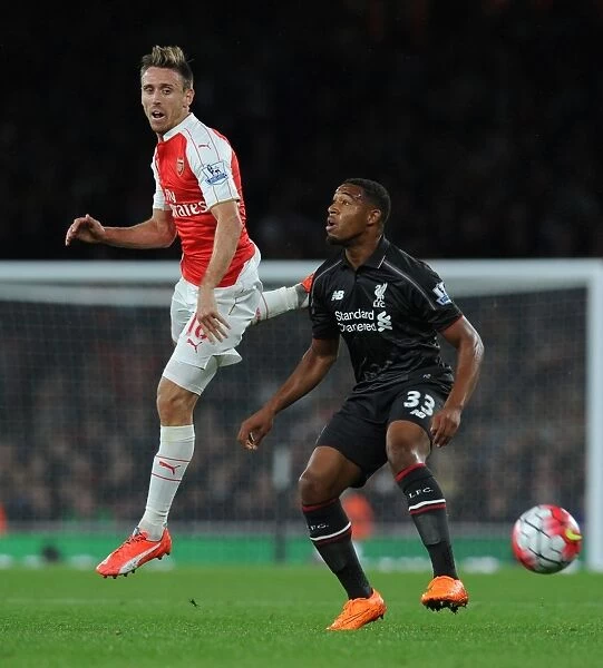 Monreal Leaps Ahead: Intense Moment as Arsenal's Defender Outjumps Liverpool's Ibe (2015 / 16)