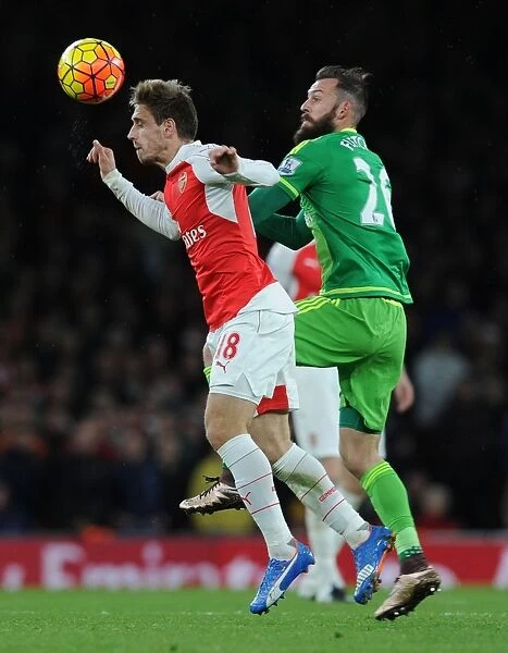 Monreal Soars Over Fletcher: Arsenal's Defender Dominates in the Air against Sunderland
