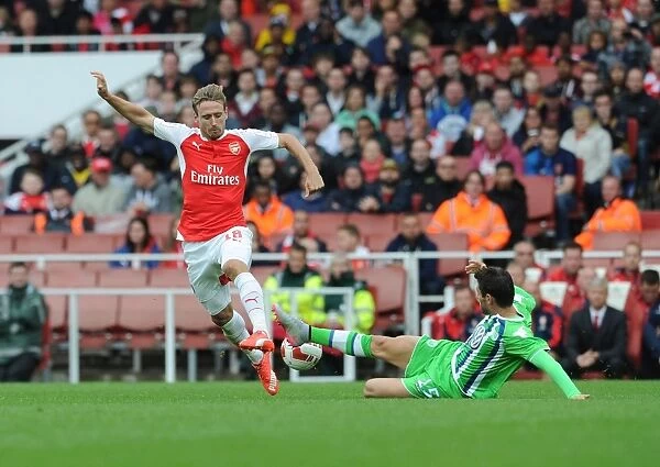Monreal vs. Trasch: Intense Clash Between Arsenal's Monreal and VfL Wolfsburg's Trasch at Emirates Cup 2015 / 16