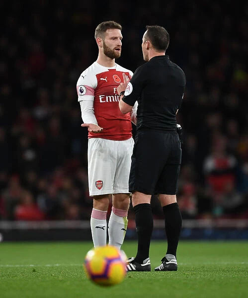 Mustafi Confronts Referee Attwell During Arsenal vs. Wolverhampton Clash (2018-19)