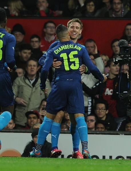 Nacho Monreal and Alex Oxlade-Chamberlain Celebrate Arsenal's FA Cup Quarter-Final Goal Against Manchester United (2015)