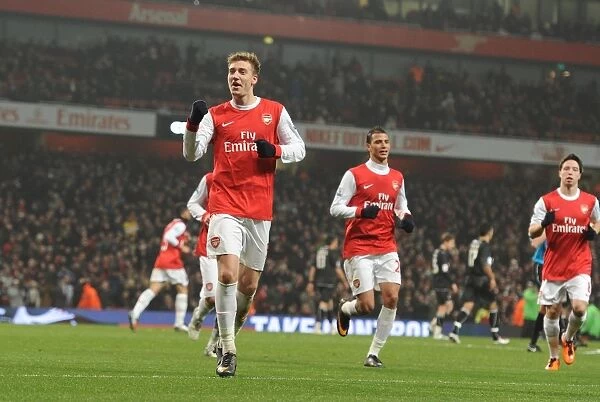 Nicklas Bendtner's Goal Celebration: Arsenal's Dominance over Leyton Orient in FA Cup Fifth Round (4-0)