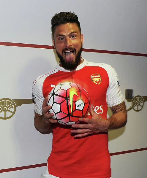 Olivier Giroud Celebrates with Match Ball: Arsenal Secures Victory over Aston Villa (2015-16)