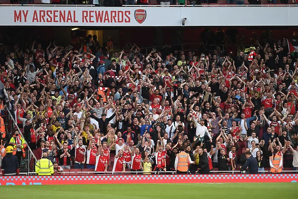 Passionate Arsenal Fans at Emirates Stadium: Arsenal vs. Tottenham in the Premier League (2021-22)