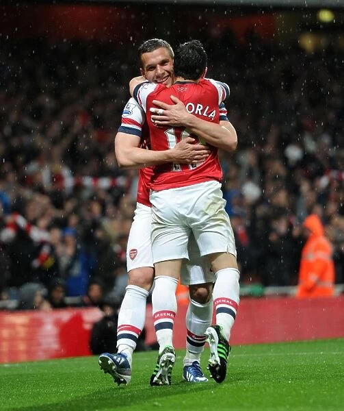 Podolski and Cazorla's Double Strike: Arsenal's Dominance Over Wigan Athletic (4-1)