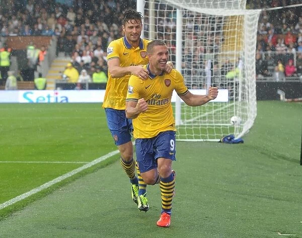 Podolski and Giroud Celebrate Arsenal's Third Goal vs Fulham (2013-14)