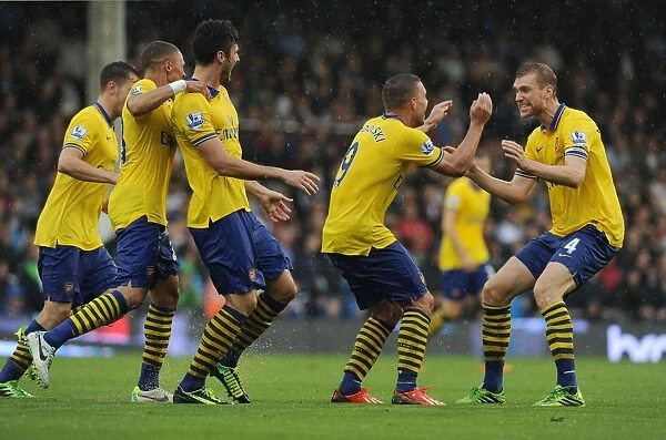Podolski and Mertesacker Celebrate Arsenal's Second Goal Against Fulham (2013-14)